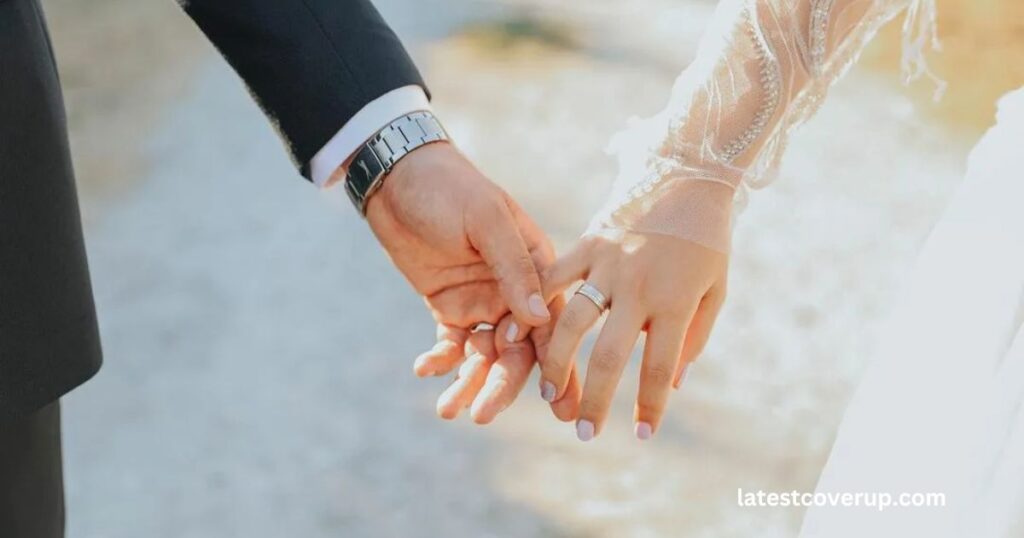 A close-up of a man and woman holding hands, symbolizing love and commitment in the context of Jyleen Flear marriage.